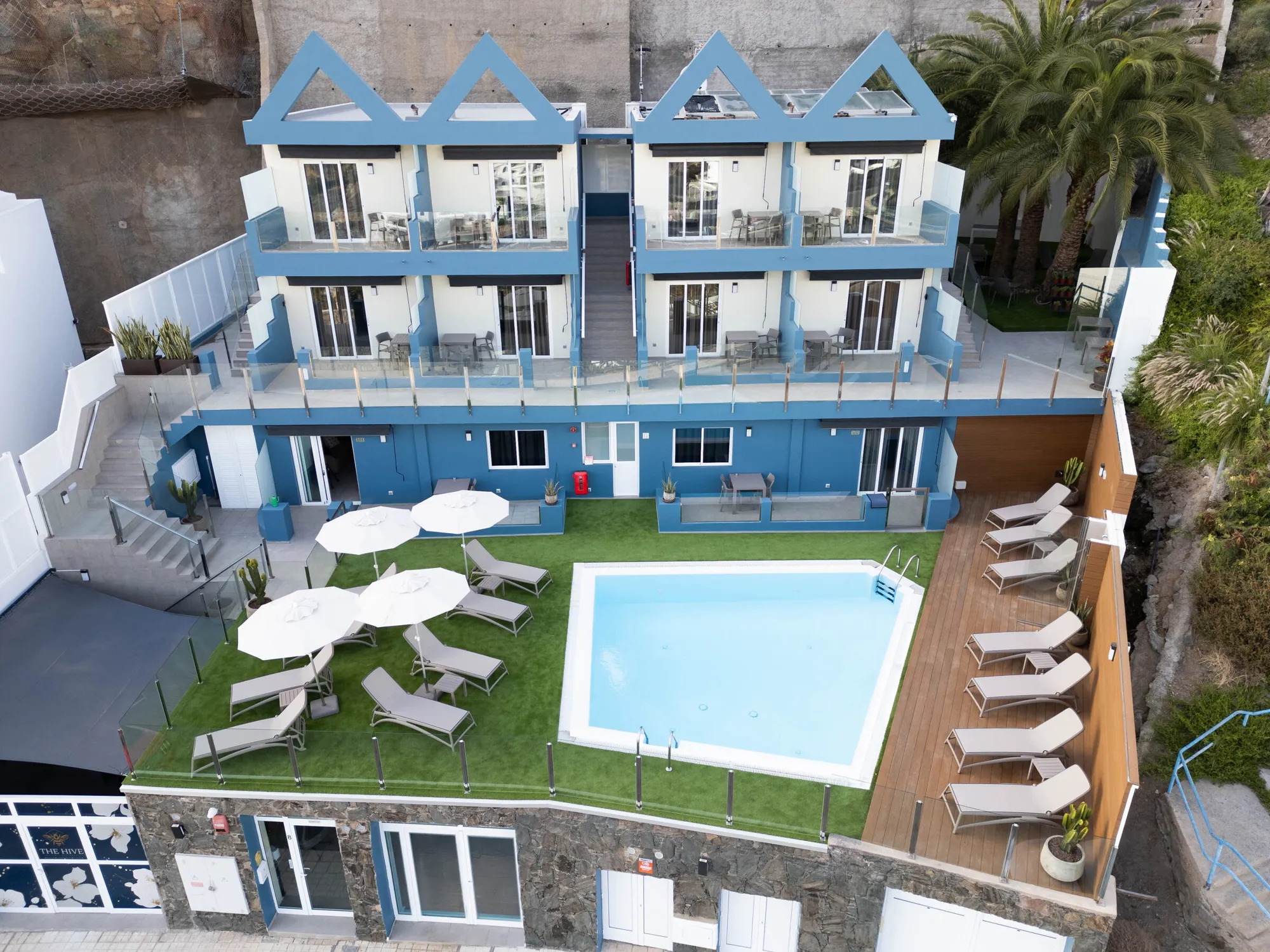 The Hive from the air: the blue gabled building above its pool and garden